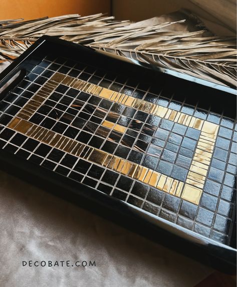 Add a touch of luxury to your home with La Noche Mosaic Tray 🌟 Handcrafted with exquisite black and gold mosaic tiles, this tray is the perfect blend of beauty and function. Whether for serving or as a decorative accent, it’s a must-have for any stylish space. Shop at decobate.com #ArtisanCrafted #HomeDecorGoals #MosaicDesign #LuxuryLiving #HandmadeWithLove #TimelessElegance #ModernTabletop #Decobate #InteriorStyling #art #artistic #gold #decor #home #mosaic #artisan #deco Gold Mosaic Tile, Mosaic Tray, Gold Mosaic, Handmade Tableware, Mosaic Designs, Gold Decor, Decor Home, Mosaic Tiles, Luxury Living