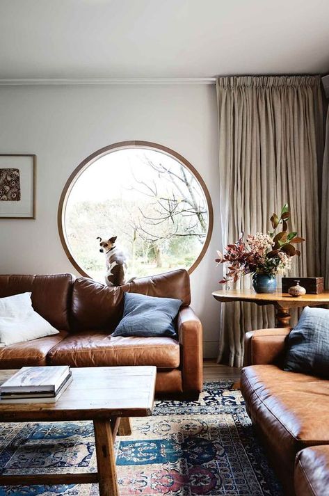 Maria Killam's Trend Forecast for 2021 | Brown And Blue Living Room, Leather Couches Living Room, Brown Living Room Decor, Brown Couch Living Room, Brown Leather Couch, Porthole Window, Leather Sofa Living Room, Round Window, Room Photo