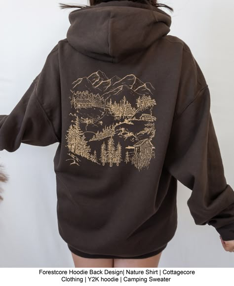 Cozy up in this forestcore hoodie. P R O D U C T I N F O: • 50/50 cotton/polyester blend • Back design - front of hoodie is blank with a kangaroo pocket. • Care instructions: Machine wash cold inside out with mild detergent and like colors for best results. Tumble dry on a low cycle or hang dry for best results. • When ordering, please keep in mind that colors may vary slightly depending on the resolution of your computer screen. S I Z I N G: • W Nature Sweatshirts, Hoodie Print Design Ideas, Hoodie Back Design, Cottagecore Hoodie, Camping Sweater, Ranching Life, Mountain Core, Nature Clothes, Forestcore Aesthetic