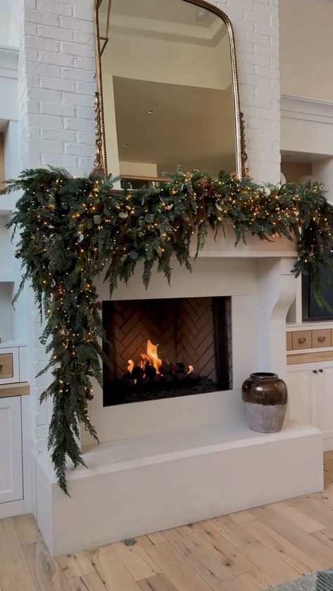 Shop Majestic Holiday Garland and other curated products on LTK, the easiest way to shop everything from your favorite creators. Mantle With Garland And Stocking, Wreath Fireplace Christmas, Minimal Christmas Outdoor Decor, Garland Christmas Fireplace, Christmas Wedding Modern, Ranch Style House Christmas Lights, Holiday Decor Mantle, Moody Christmas Mantle Decor, Tall Mantle Christmas Decor