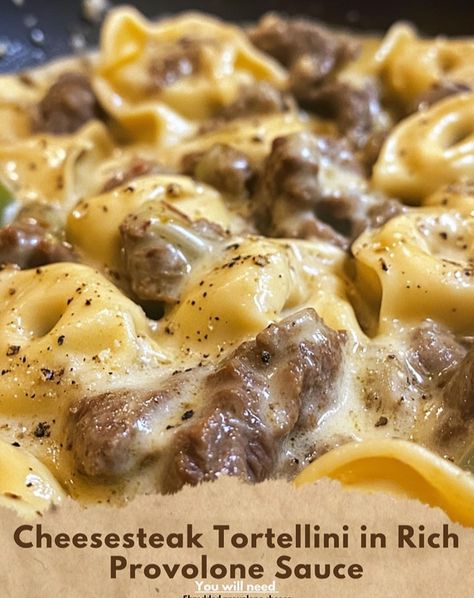 Cheesesteak Tortellini in Rich Provolone Sauce Indulge in this creamy, cheesy delight that brings together the flavors of a classic cheesesteak with the comforting texture of tortellini! Ingredients: - Cheese tortellini - Shredded provolone cheese - Onion - Green bell pepper - Butter - Thinly sliced beef steak (ribeye or sirloin) - Flour - Milk Instructions: 1. Cook the cheese tortellini as per package instructions, then drain and set aside. 2. In a skillet, melt 1 tablespoon of butter and... Cheesesteak Tortellini, Steak Ribeye, Green Bell Pepper, Pasta Dinner Recipes, Cheese Tortellini, Provolone Cheese, Alfredo Sauce, Beef Steak, Provolone