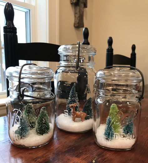 These DIY snow globes are easy to make, and so impressive looking! I prefer antique mason jars, but any kind will do.   Click on the photo to see how I made them in my Blog! Diy Mason Jar Snow Globes, Mason Jar Snow Globe Diy, Mason Jar Snow Globe Lids, Diy Christmas Snow Globes Mason Jars, Jar Snow Globes, Antique Mason Jars, Snow Globe Topped Mason Jar, Snow Globe Mason Jar, Mason Jar Snow Globe