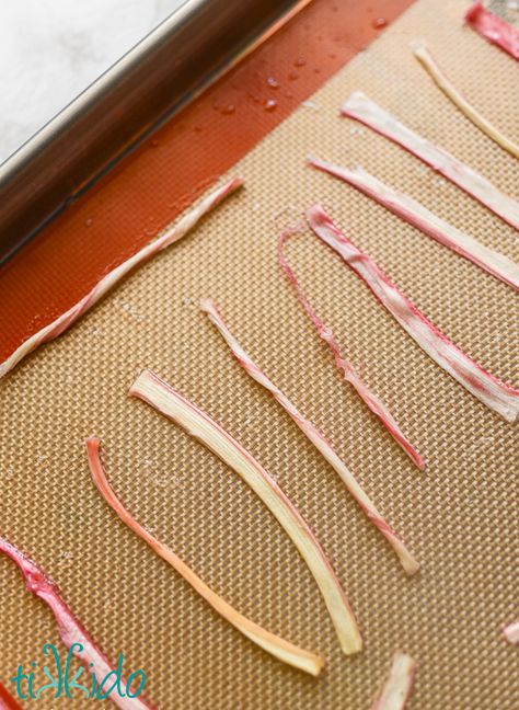 Strips of candied rhubarb on a silpat liner in a metal sheet pan. Homemade Lollies, Candied Rhubarb, Roasted Rhubarb, Farmhouse Dinner, Rhubarb Compote, Rhubarb Desserts, Dehydrated Foods, Easy Foods, Cherry Jam