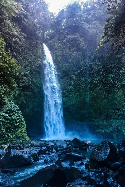 If you want to explore Bali waterfalls, why not go on a Bali waterfall adventure? Discover one of the best waterfalls in Bali including Nungnung Waterfall. Waterfall Bali, Gouache Ideas, Bali Waterfalls, Travel International, Waterfall Adventure, Chasing Waterfalls, Scenery Photos, Waterfall Photography, Water Falls