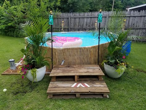 pop-up tiki pool, reed fencing, tropical planters, tiki torches, pool decorations, pallet stairs, paradise Outdoor Pool Area, Swimming Pool Landscaping, Landscaping Diy, Small Backyard Landscaping Ideas, Tropical Backyard, Landscaping Flowers, Above Ground Pool Landscaping, Backyard Landscaping Plans, Landscaping Garden