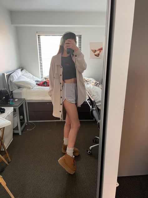 comfy casual speing outfit platform ankle Uggs with slouchy long socks mini shorts and cropped baby tee and long sleeve shirt jacket Speing Outfits, Ankle Uggs, Short Uggs Outfit, Sock Outfits, Uggs Outfit, Comfy Outfit, Long Socks, Fleece Shorts, Mini Shorts