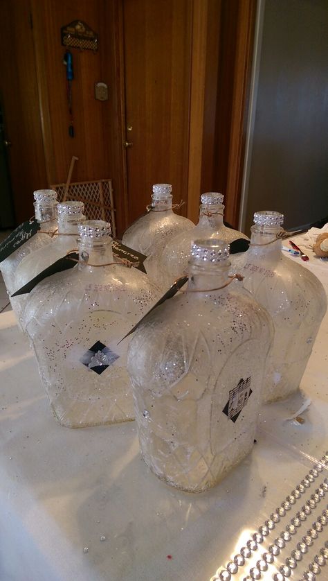 Glazed over Crown Royal bottles to make into centerpieces Crown Royal Centerpiece Weddings, Crown Royal Wedding Decorations, Crown Royal Bottle Centerpiece Weddings, Crown Royal Centerpiece Ideas, Crown Bottle Centerpieces Wedding, Alcohol Bottle Centerpieces, Crown Royal Diy, Royal Wedding Decorations, Crown Royal Bottle