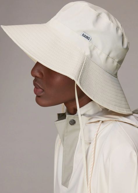 Buy Ivory Rains Boonie Hat | WHISTLES whistles.com. A transitional accessory we can't get enough of - this Rains Bucket Hat is 100% waterproof in an easy, white hue. Rain Hats For Women, Boonie Hat Outfit, Relaxed Hat, Fashion Bucket Hat, Scandinavian Heritage, Waterproof Hat, Rain Fashion, Bucket Hat Fashion, White Bucket Hat