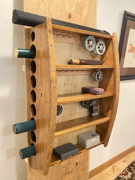 Fly Rod tube and reel holder with shelves and wine barrel staves Fly Rod Tube Storage, Fly Tying Room Ideas, Fly Rod Storage, Fishing Room Decor, Fly Rod Holder, Fly Fishing Decor, Outdoor Gear Storage, Diy Fishing Rod, Fishing Rod Stand