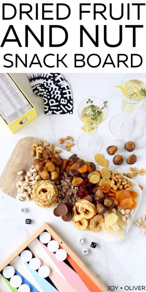 New Years Eve Dried Fruit and Snack Board made of a variety of sweet, salty, spicy and chocolate pairs perfectly with a game night in to end the year. This board makes the perfect appetizer for any holiday or gathering! #appetizer #cheeseboard #nuts #driedfruit Nut Board Ideas, Chocolate Pairings, Appetizer Trays, Nut Snacks, New Year's Eve Recipes, Holiday Dessert Recipes, Easy Appetizers, Snack Board, Charcuterie Recipes