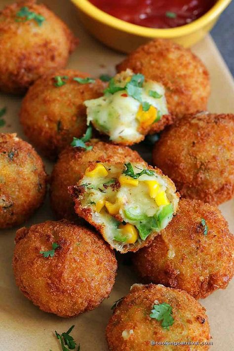 Easy to make and addictive, these Cheese corn balls are an ideal snack for kids as well as for adults. They are also perfect for parties, potlucks, get-togethers, and a true crowd-pleaser. They are soft from the inside and crispy from the outside. They are an absolute indulgence during the cold or rainy season. The best part is you can make a mixture and roll the ball, then store it in the fridge and deep fry within minutes whenever required and enjoy hot. #snacks #corn #cheeseballs #Kids Paneer Cheese Corn Balls, Corn Balls Fried, Corn Balls Recipe, Cheese Corn Balls, Cheese Corn Balls Recipe, Corn Ball, Corn Balls, Continental Food, Vegetarian Kids