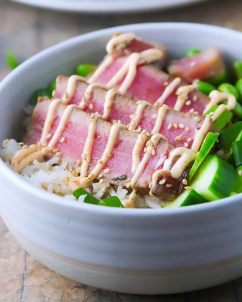 Seared Tuna Poke Bowls: soy sauce-marinated ahi tuna steaks , cilantro rice, fresh veggies and a spicy mayo sauce, this is a tasty and filling meal! . Recipe via @sanna.womanscribbles . #ahipoke #pokebowls #tunapokebowl #whatsforlunch #whatsfordinner #bonappetit #easymeals #foodblogfeed #foodphotography #yycfoodphotographer . https://www.womanscribbles.net/seared-tuna-poke-bowls/ Cooking Ahi Tuna, Ube Flan, Ahi Tuna Steaks, Lemon Quinoa, Custard Buns, Tuna Poke Bowl, Mini Bun, Flan Cake, Salmon Spices