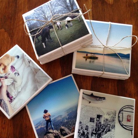 Waterproof Photo Tiles I used some basic white ceramic tiles (20¢ each) and painted a coat of Mod Podge right onto the glossy part of the tile and laid my photo flat. I let them dry for about an hour, then did another layer of Mod Podge right on top of the photo (it dries clear), followed by three layers of clear lacquer.   This project does take a few days since lacquer needs about three hours to dry in-between. They are waterproof, they can be used as coasters. Custom Photo Coasters, Ceramic Tile Crafts, Coasters Christmas, Coworkers Christmas, Photo Coasters, Tile Crafts, Photo Tiles, Diy Coasters, Personalized Coasters