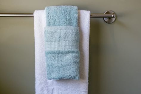 Some bath towels are quite expensive and you may purchase them only for display purposes. Hanging your bathroom towels decoratively is a great way to display them in your guest bathroom or any time you want to hang your plush towels in a fancy manner. Folding your towels decoratively will make your family, guests or friends feel pampered, as if... How To Hang Bathroom Towels Decoratively, How To Display Towels, Display Bathroom Towels, How To Hang Bathroom Towels, How To Hang Towels, Towels In Bathroom, Towel Hanging Ideas, Bathroom Towels Display, Hanging Bath Towels