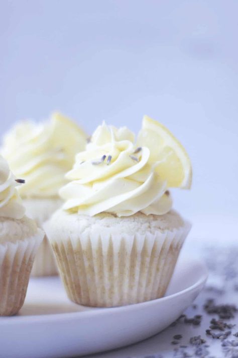 close up of lavender lemon cupcakes on a plate Lemon Lavender Cupcakes, Lemon Swiss Meringue Buttercream, Swiss Meringue Buttercream Frosting, Meringue Buttercream Frosting, Fluffy Buttercream Frosting, Fluffy Buttercream, Homemade Cupcake Recipes, Lemon Cupcake Recipe, Lavender Cupcakes