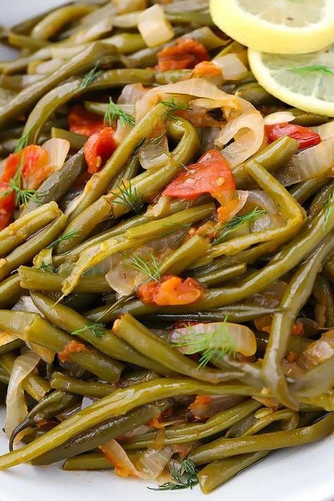 These Greek Green Beans (Fasolakia) are velvety tender, served in a tomato and garlic based sauce with lemon, dill, and plenty of extra-virgin olive oil. It's a great Mediterranean, low carb, paleo, and vegan side dish! Mediterranean Low Carb, Greek Side Dishes, Greek Goodness, Greek Green Beans, Vegan Board, Greek Christmas, Couples Dinner, Greek Foods, Lemon Green Beans