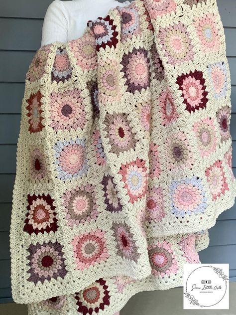 **PLEASE READ ENTIRE LISTING DESCRIPTION PRIOR TO ORDERING** * Handmade crochet afghan with assorted pink sunburst granny squares, joining color in "oats". Order today, this blanket is READY TO SHIP!  * Blanket is made from soft 100% acrylic yarn and measures approximately 60x70 inches.  * Suggested care instructions: Dry clean recommended. Blankets can be machine washed cold on delicate cycle. (Preferably in a mesh garment bag to prevent snagging). Tumble dry on low heat, or lay flat to dry. * I DO NOT SELL THE PATTERNS TO MY BLANKETS. Lots of time, love, and money go into each blanket, and my listings are for the finished product. If you are looking for patterns, there are other Etsy vendors who do sell them.  * You can follow Seven Little Owls on several social media platforms for info Pink Granny Square Blanket, Sunburst Granny Square Blanket, Pink Granny Square, Crochet Sunburst, Granny Square Crochet Blanket, Square Crochet Blanket, Sunburst Granny Square, Crochet Clothing And Accessories, Pink Crochet