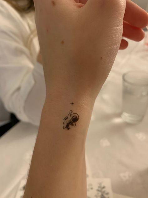 Cute Astronaut Tattoo, Small Space Themed Tattoos, Tattoo Astronaut, Tiny Astronaut Tattoo, Mini Astronaut Tattoo, Stargazing Tattoo, Small Astronaut Tattoo, Rocket Ship Tattoo, Spaceship Tattoo