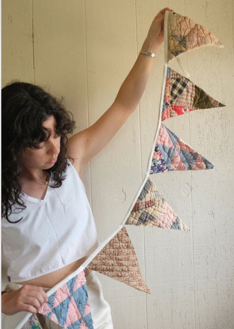 * a great add on if you are getting a quilt coat made!! use the scraps for a bucket hat you will supply us with your own quilt to purchase this item! the pattern created for this bunting is our Reclaim Quilt Bunting - the perfect decor for your home, office, or gift to a friend. Length will be about 80” long - each triangle is roughlt 7” wide and 9.5” long, the binding is 12” on each side. quilts/quilt scraps must measure at least 10" x 60" for a bunting - if you have specific questions about yo Quilt Bunting Banner, Quilted Holiday Gifts, Easy Things To Sew With Scraps, Things To Sew With Cotton Fabric, Vintage Sheets Quilt, Home Made Baby Gifts, Sewing Projects For Scraps, Sewing Wall Hanging, Sewing Begginers Projects