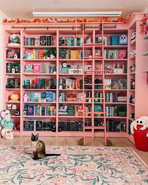 i don’t want to hear… a single.. word 🤫🤫🤫 first & foremost, not that i owe any explanations lol i just want to say that i did *not* paint my bookcases pink again for/bc of the grown ladies who were sending me hate mail & threatening to unfollow 💀 the green was beautiful & cozy & i loved it but from the beginning it just didn’t feel like ✨me✨ & after sitting w it for a few days i was really not feeling comfy w it SECOND if you really focus & pay attention to the color pink… it IS different ... Girly Library, Pink Bookcase, Small Library Ideas, Grown Up Bedroom, Different House Styles, Hidden Spaces, Wardrobe With Dressing Table, Education Design, Pink Decor