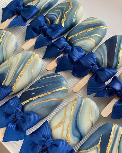 Blue And Gold Candy Buffet, Royal Blue Macarons, Blue And Gold Cakesicles, Navy And Gold Dessert Table, Navy Blue And Gold Dessert Table, Blue And Gold Cookies, Navy Dessert Table, Graduation Cakesicles, Magnum Cake