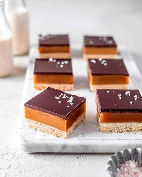 Classic Vegan Caramel Slice (no dates) | Rainbow Nourishments Millionaire Bar, Rainbow Nourishments, Vegan Caramel Slice, Caramel Cookie Bars, Vegan Condensed Milk, Vegan Dessert Bars, Chocolate Caramel Slice, Corner Bakery, Vegan White Chocolate