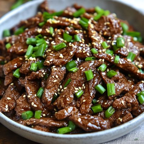 🍖 Savor the authentic flavors of Traditional Korean Bulgogi—marinated beef that's both savory and sweet! 🇰🇷🍴 #Bulgogi #KoreanBBQ Traditional Korean Bulgogi Ingredients: Beef sirloin (1 lb, thinly sliced) Soy sauce (1/4 cup) Brown sugar (2 tbsp) Sesame oil (2 tbsp) Garlic (3 cloves, minced) Ginger (1 tsp, grated) Green onions (2 stalks, chopped) Sesame seeds (1 tbsp) Instructions: In a bowl, mix soy sauce, brown sugar, sesame oil, garlic, ginger, and green onions. Add beef and marinate for... Korean Bulgogi, Instagram Recipes, Bulgogi Beef, Marinated Beef, Beef Sirloin, Cute Food Art, Bulgogi, Trending Recipes, Korean Bbq