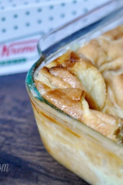 donut bread pudding in a casserole dish in front of a krispy kreme box. Krispy Cream Bread Pudding, Leftover Donut Bread Pudding, Donut Casserole, Donut Bread Pudding Recipe, Krispy Kreme Bread Pudding, Doughnuts Baked, Donut Bread Pudding, Donut Bread, Instant Pot Freezer Meals