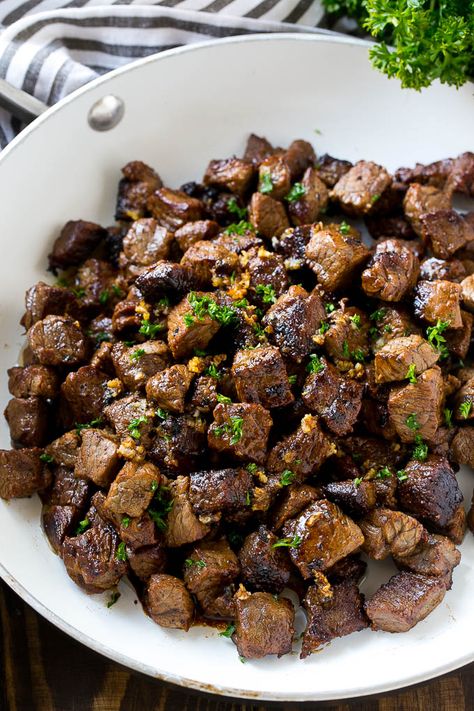 A frying pan of steak bites tossed in garlic butter. Steak Bites With Garlic Butter, Glazed Steak, New York Strip Steak, Skirt Steak Recipes, Steak Bites Recipe, Garlic Steak, Steak Dishes, Beef Steak Recipes, Steak Tips