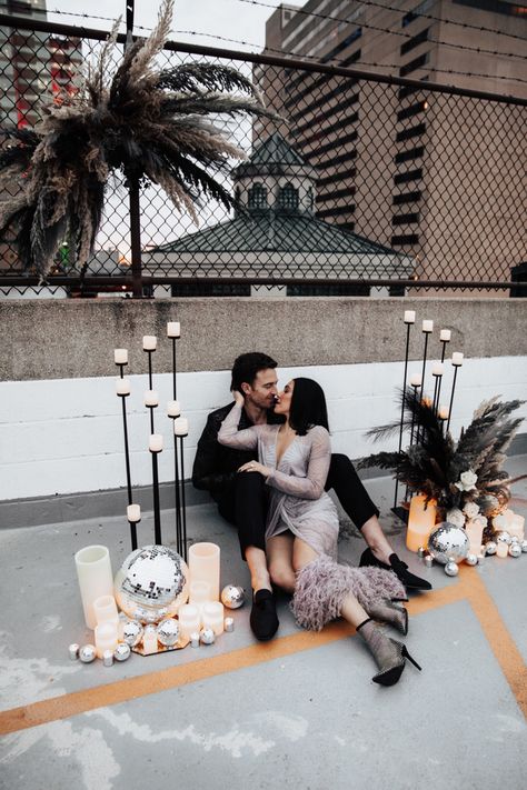 Bride + Groom embracing each other at a rooftop ceremony, surrounded by candles and disco balls. Rooftop Engagement Photos, Rooftop Engagement, Edgy Vibes, Dark Florals, Alternative Style, Disco Balls, Nashville Tn, Disco Ball, Style Wedding