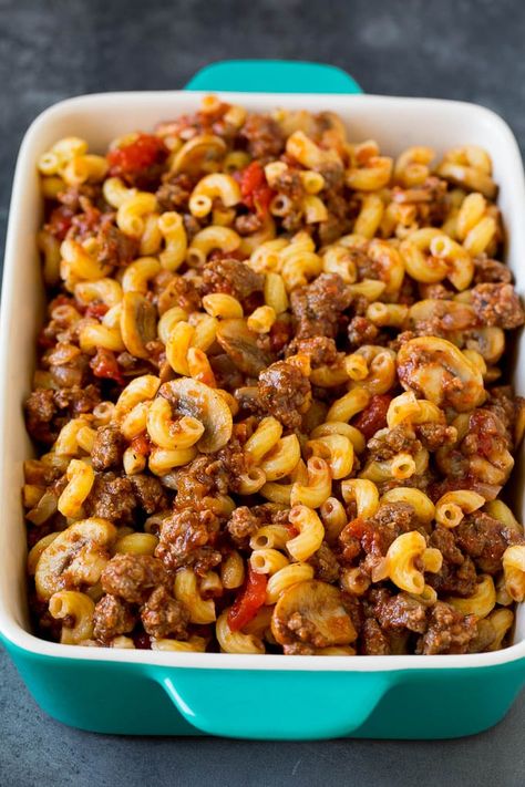 This hamburger casserole is ground beef and mushrooms in tomato sauce, tossed with pasta and topped with melted cheese. Ground Beef Mushroom Pasta, Pasta With Hamburger Meat, Cheap Ground Beef Recipes, Ground Beef And Mushrooms, Beef And Mushrooms, Hotdish Recipes, Beef Pasta Recipes, Hamburger Casseroles Recipes, Hamburger Dishes