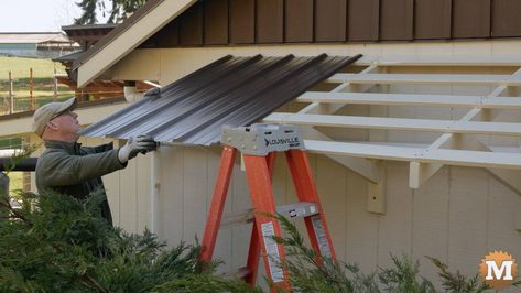 Build a wall mounted awning frame from wood with a steel roof attached to the side wall of a workshop. This is an easy DIY woodworking project. Shed Awning Ideas, Build An Awning, Diy Awnings, Wood Awning, Awning Over Door, Awning Ideas, Awning Roof, Diy Awning, House Awnings