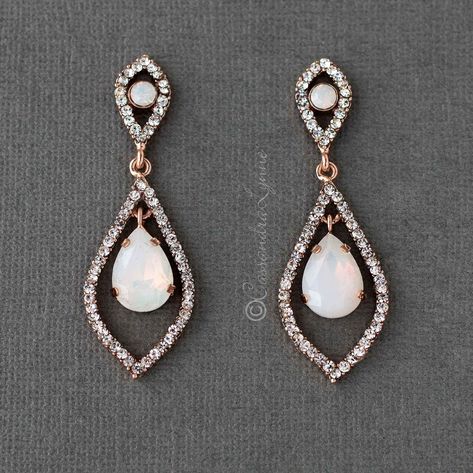 A rhinestone adorned leaf setting has an opal pear jewel as the centerpiece in these bridal earrings. A simple way to add opal accents to your wedding day style! They are available in rose gold or silver plate with all clear stones and measure 2 inches long and .75 inches wide, lead compliant, nickel free. Skull Jewelry Women, Wedding November, Boho Bridal Jewelry, Buy Earrings Online, Boho Wedding Earrings, Rose Gold Wedding Jewelry, Tiffany And Co Necklace, Wedding Accessories Jewelry, White Gold Necklaces