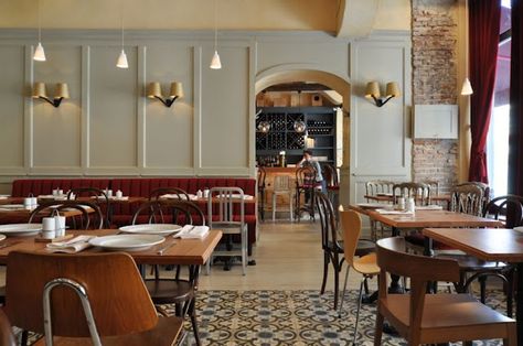 la bonn bouche bistro; red upholstered banquette + cast iron tables + cement tiles + tom dixon wall lamps + various chairs + gray + bricks + blue Bistro Interior Design, Bistro Interior, Bistro Design, Bistro Restaurant, Cafe Concept, French Restaurant, Cafe Bistro, French Cafe, French Restaurants