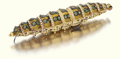 Lot | Sotheby's A JEWELLED GOLD AND ENAMEL AUTOMATON SILKWORM, ALSO KNOWN AS THE 'ETHIOPIAN CATERPILLAR', MADE FOR THE CHINESE MARKET, GENEVA, CIRCA 1810 Clockwork Mechanism, Automata Mechanical, Enamel Rings, Chinese Market, Beautiful Bugs, Insect Jewelry, Enamel Ring, Gold Texture, Black Enamel