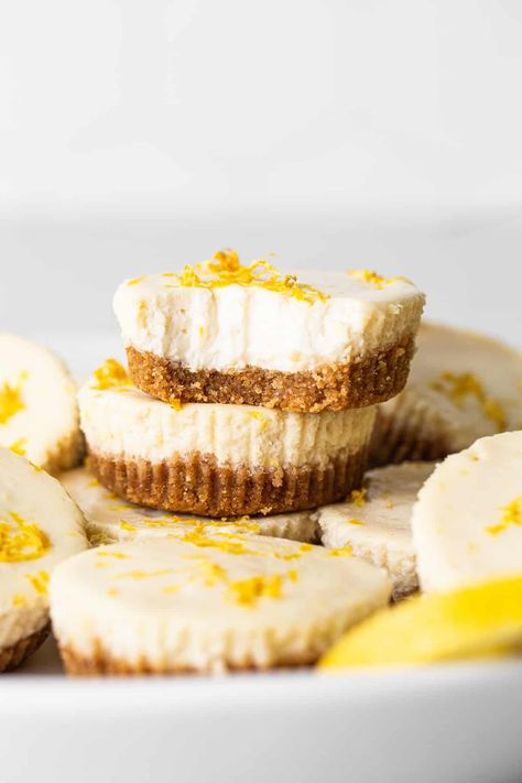 This mini cheesecake recipe is made with a sweet and salty crust, cream cheese, honey, vanilla, and lemon zest making them the perfect Spring dessert. Mini Lemon Cheesecake Bites, Mini Lemon Cheesecake, Lemon Cheesecake Bites, Lemon Cheesecakes, Baked Graham Cracker Crust, Greek Yogurt Cheesecake, Mini Lemon Cheesecakes, Mini Cheesecake Bites, Trail Mix Cookies