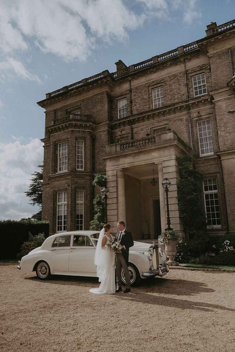 Bride in Savannah Miller wedding dress and groom in three piece grey suit standing by classic wedding car outside of Hedsor House country house wedding venue search Edible Flowers For Cakes, Vintage Romance Wedding, Candlelit Ceremony, Hedsor House, Country Manor House, English Country Weddings, Country House Wedding Venues, Country House Wedding, Castle Wedding Venue