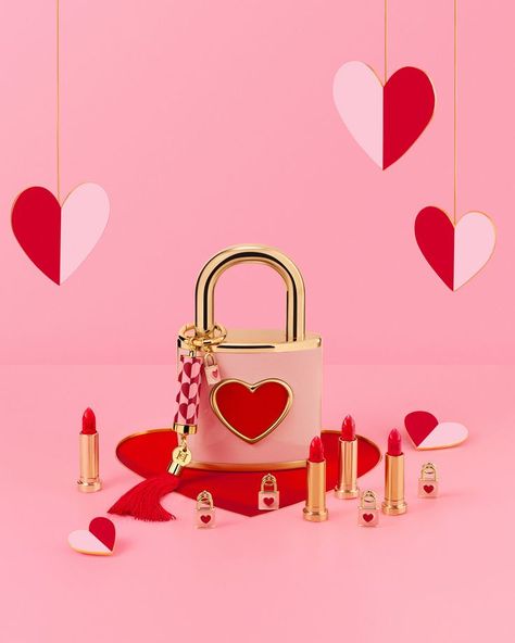 Lipsticks displayed with lock with heart design Valentines Still Life, Nice Letters, Cosmetic Packaging Design, Valentines Day Makeup, Lip Makeup Tutorial, Valentine Photo, Highlight Icons, Cosmetic Packaging, Carolina Herrera