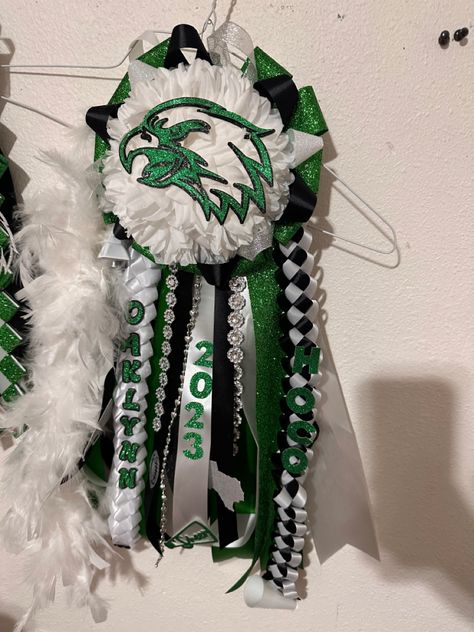 Homecoming #hocomum #eaglefootball #homecoming #homecominggarter #mums #garter #green #white #black #eagles #football Green Mums Homecoming, Green And Gold Homecoming Mums, Green Black And White Homecoming Mum, Peewee Homecoming Garter, Garder Mum Homecoming, White Garters, Homecoming Garter, Homecoming Mums, Football Season