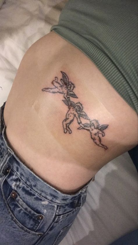 Angle Rib Tattoo, Rib Angel Tattoo, Angel Belly Tattoo, Angel Stomach Tattoos Women, Angel Rib Tattoo, Angel On Ribs Tattoo, Cherub Rib Tattoo, Abdomen Tattoo, Cupid Tattoo