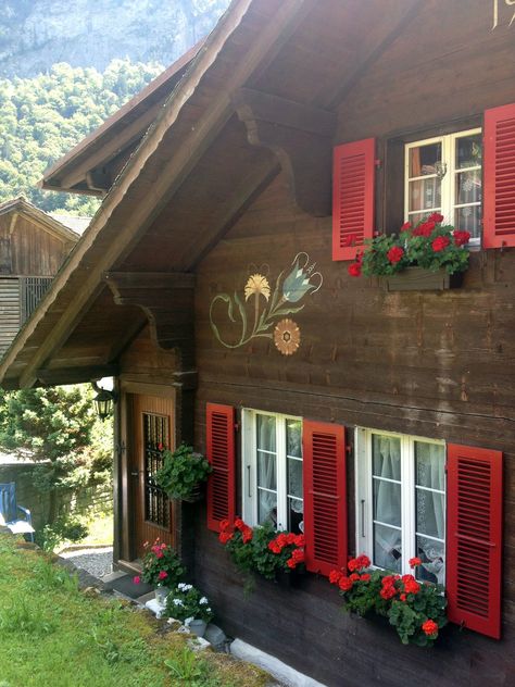 Heidi House Switzerland, Brown House Red Trim, Brown House With Green Trim, Brown House With Shutters, Swiss Cabin Chalet Style, Switzerland House Cottages, Bavarian Cabin, Chalet Windows, Bavarian Cottage