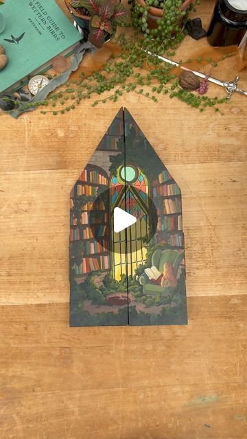 Lizzy Gass on Instagram: "The stained glass window in this enchanted library becomes a door into the world of whichever book the reader is enjoying. What book would you like to spend the day in (or what book might you want to leave the window closed for)?
.
.
The new collection is finally here and it includes this lovely folding panel and its prints!
.
.
Supplies:
Panel - gifted from Trekell
Paint -  Holbein acrylic gouache 
.
.
#gouachepainting #readingaesthetic #fairytaleart #dragonart" Enchanted Library, Acrylic Gouache, The Reader, What Book, Fairytale Art, Stained Glass Window, Dragon Art, Gouache Painting, Stained Glass Windows