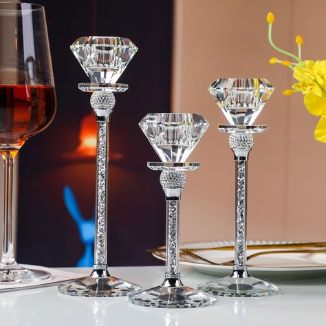 PRICES MAY VARY. Elegant Trio: Elevate your home decor with this exquisite set of three conical crystal candle holders. Each set includes candle holders of varying heights (17cm, 20cm, and 23cm) for a captivating display that adds an elegant touch to any room. Premium Quality: Crafted with precision, these candle holders are made from high-quality crystal to ensure clarity, brilliance, and a stunning interplay of light. They're designed to impress and create a sophisticated ambiance in your livi Glitz And Glam Party Centerpieces, Candle Holder Table Decor, Royal Wedding Centerpieces, Diamond Theme Party, Wedding Decorations Elegant, Bling Candle Holders, Tall Candle Holder, Pearl Bridal Shower, Chandelier Centerpiece