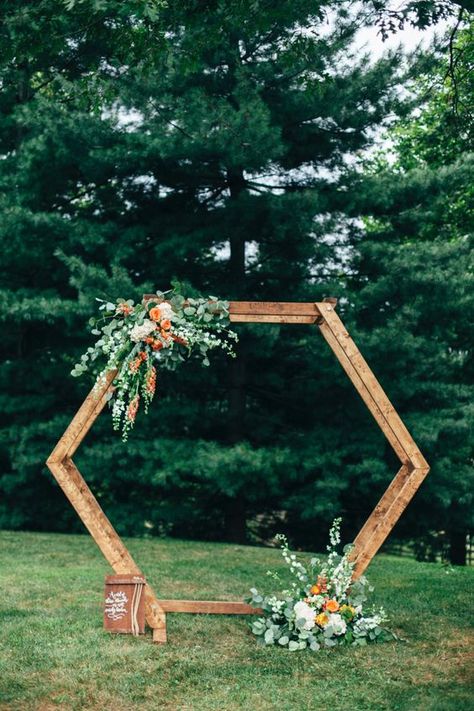 a bright hexagon wedding arch decorated with greenery, white and orange blooms for a bold summer or fall wedding Hexagon Wedding Arch, Hexagon Arch, Nature Inspired Wedding Ring, Bush Wedding, Hexagon Wedding, Nature Inspired Wedding, Wedding Arch Flowers, Event Planning Tips, Arch Flowers