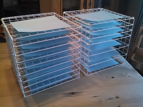 Art drying racks shown with papers. Cost $17 per cube. Diy Art Drying Rack Classroom, Art Drying Rack Diy, Diy Art Drying Rack, Papercraft Storage, Diy Drying Rack, Art Drying Rack, Cube Furniture, Studio Storage, Stand Feria