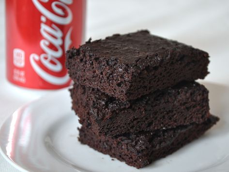 Coca Cola Brownies | In a weird feat of cooking magic, you can actually bake brownies by substituting the wet ingredients (typically eggs and vegetable oil or butter) with a can of cola. The result is a dark, damp brownie with a fudgy yet springy crumb. Coca Cola Recipes, Coke Recipes, Cola Recipe, Cola Cake, Homemade Brownies, No Bake Brownies, Serious Eats, Brownie Mix, Vegetarian Chocolate