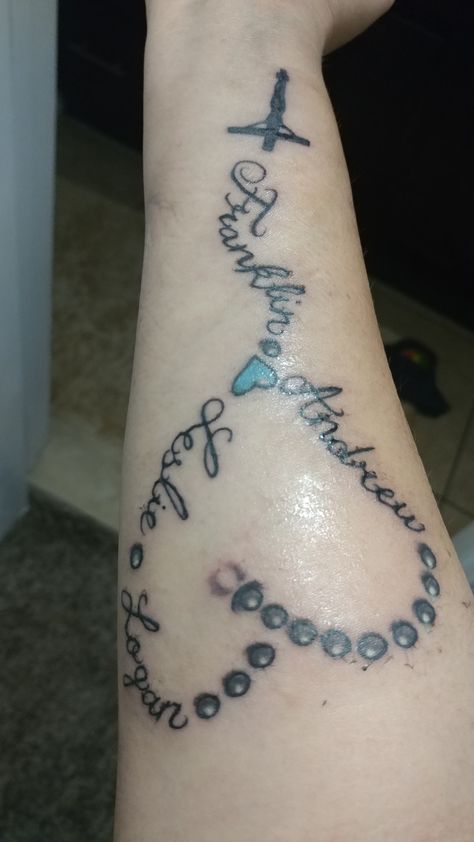 Rosary 💙 with my Kids names  So in love with it! 😊 Rosary Name Tattoo, Rosary Tattoo With Names, Name Tattoos For Moms, Memorial Tattoo Designs, Mommy Hairstyles, Rosary Tattoo, Necklace Tattoo, Pisces Tattoos, Memorial Tattoo