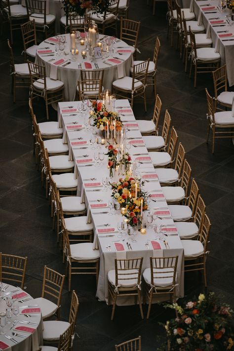 Long rectangular guest table with summer florals and candlesticks. PC: Tyler Boye Photography https://tylerboye.com/ One Long Table Wedding, Rectangular Table Decor Wedding, Rectangle Reception Tables Centerpieces, Long Wooden Table Wedding Decor, Rectangular Table Wedding Layout, Rectangle Tables Wedding Reception, Family Style Wedding Dinner Table, Long Table Wedding Centerpieces, Rectangle Table Centerpieces Wedding