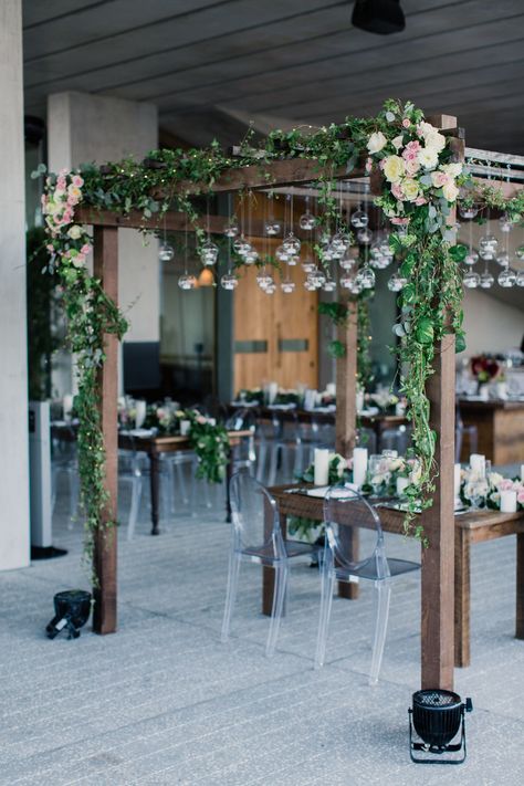 Instead of having a wedding arbor at their ceremony, Kristin and Andrew had a similar construction at their reception. The raw, wooden sweetheart table was surrounded with a matching four-post structure, covered in greenery, roses and hanging glass orbs. Perez Art Museum Miami, Bridal Vibes, Perez Art Museum, Terrarium Wedding, Deco Living, Hanging Terrarium, Wedding Arbour, Reception Inspiration, Decor Photography