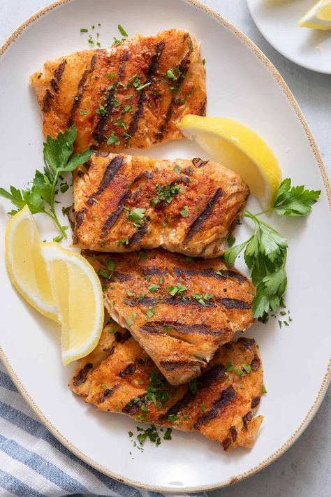 Deliciously moist grilled cod with a simple seasoning ready in just 15 minutes! Plus, helpful tips for keeping your cod from sticking to the grill! | Grilled Cod | Summer Grill Recipes | Grilling Fish | Weeknight Meal | Grilled Cod Recipes, Oven Baked Cod, Feel Good Foodie, Grilled Cod, Cod Fish Recipes, Grilled Fish Recipes, Frozen Fish, Air Fryer Fish, Fish Dinner Recipes